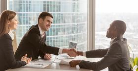 shaking hands during business meeting